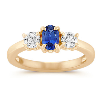A yellow gold sapphire and diamond ring